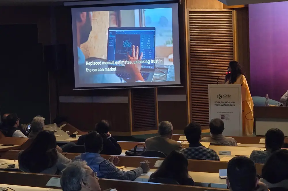 A speaker presents AI for impact work on stage at the Koita Foundation Tech Awards 2025